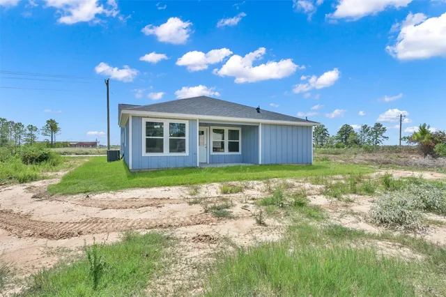 a house view with a garden space