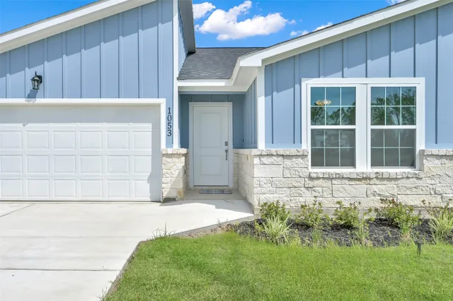 a front view of a house having yard
