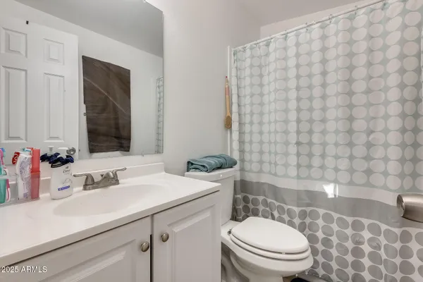 a bedroom with a bed and tv