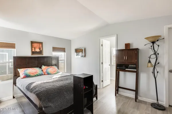 a bedroom with a bed and a television in it