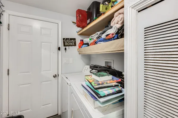 a bathroom with a toilet and a shower curtain