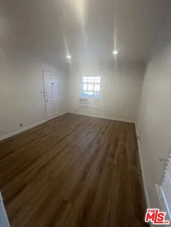 a view of a terrace with furniture and a yard