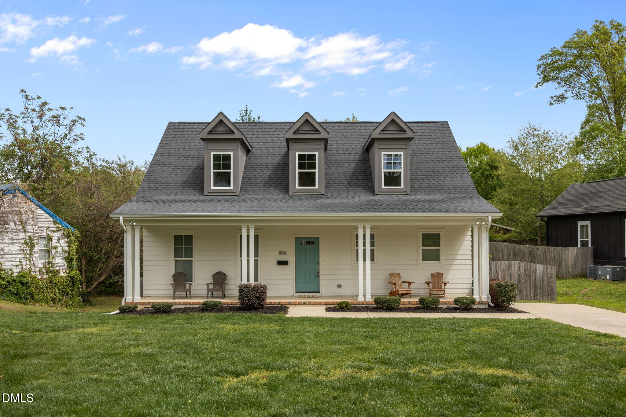 804 Hartford Road Raleigh, NC 27610 - Photo 1 of 26 a front view of a house with a garden