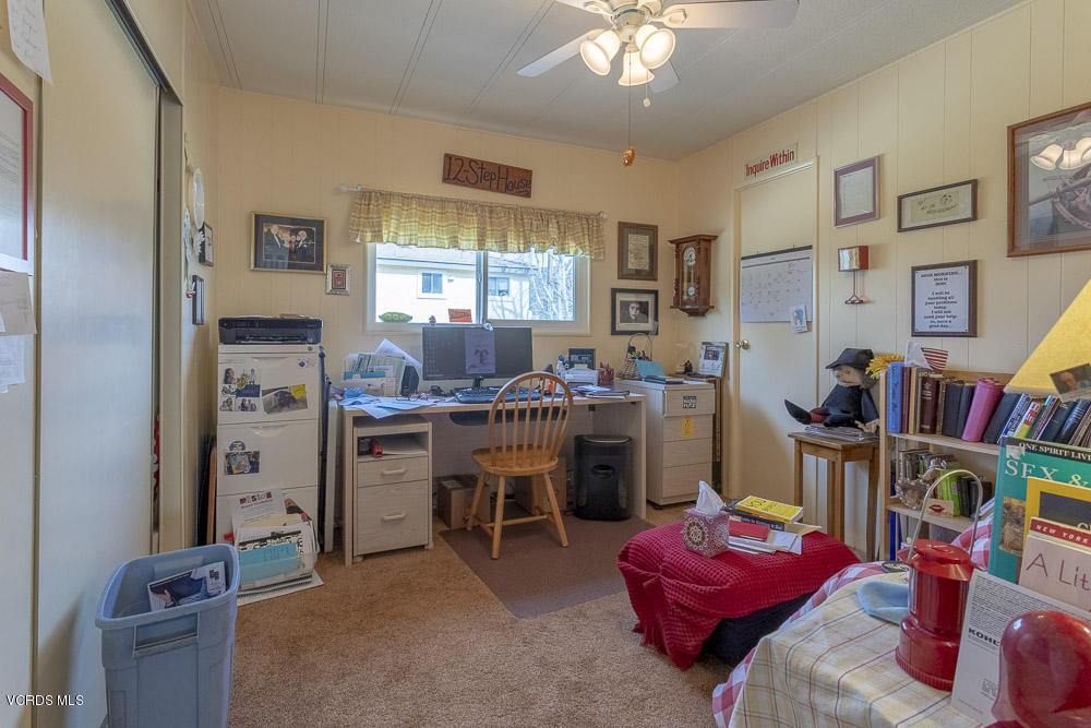6480 Katherine Road, Unit 1 Simi Valley, CA 93063 - Photo 14 of 23 a room with furniture a chandelier and a large window