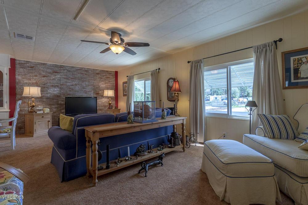 6480 Katherine Road, Unit 1 Simi Valley, CA 93063 - Photo 5 of 23 a living room with furniture and a fireplace