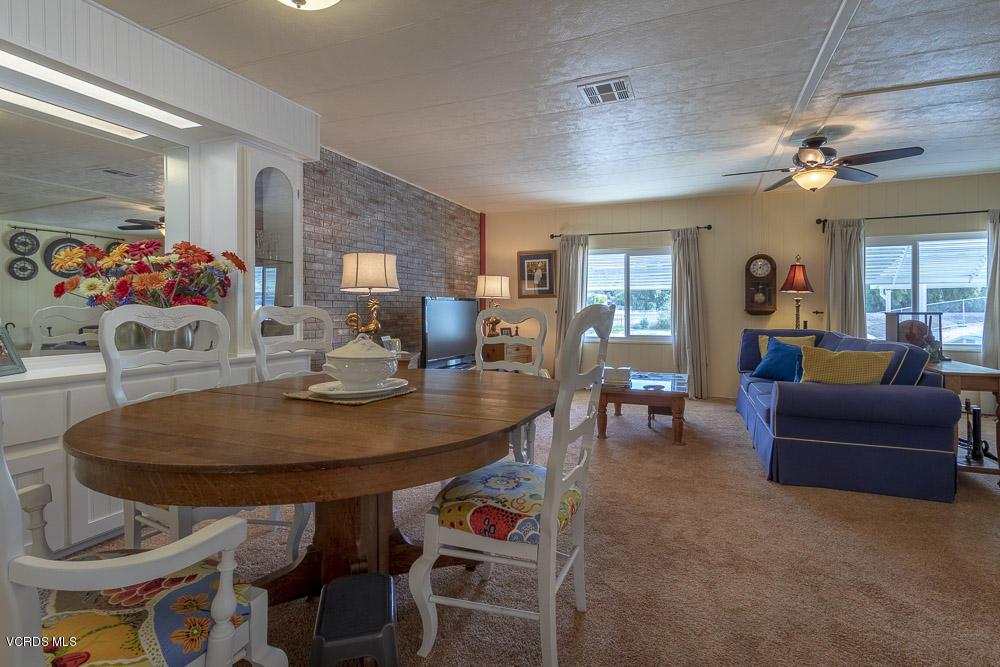 6480 Katherine Road, Unit 1 Simi Valley, CA 93063 - Photo 8 of 23 a view of a dining room with furniture and a chandelier