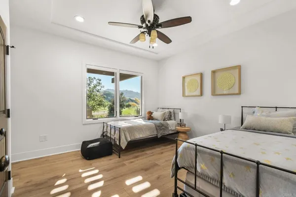 a bedroom with furniture and a window
