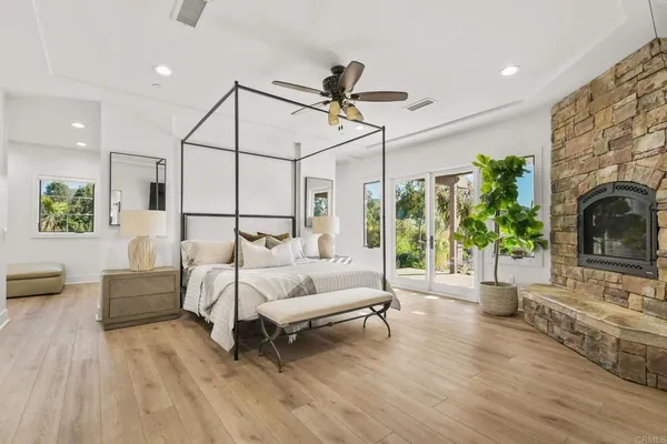 a bed room with furniture and a fireplace