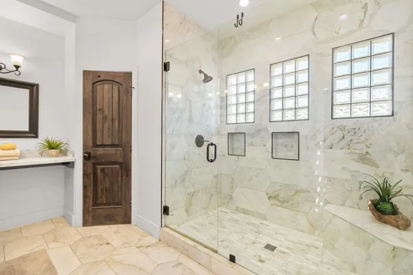 a bathroom with a bathtub and a shower