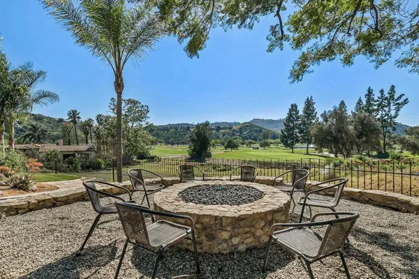 a view of a chairs and table in the patio
