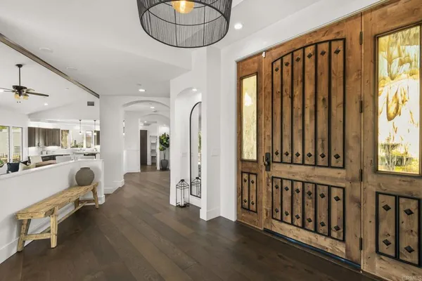 a view of a livingroom with furniture and hardwood floor