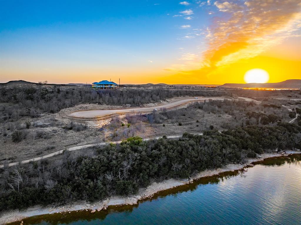 Tbd Tbd Clearwater Point Graham, TX 76450 - Photo 3 of 10 a view of a lake with mountains in the background