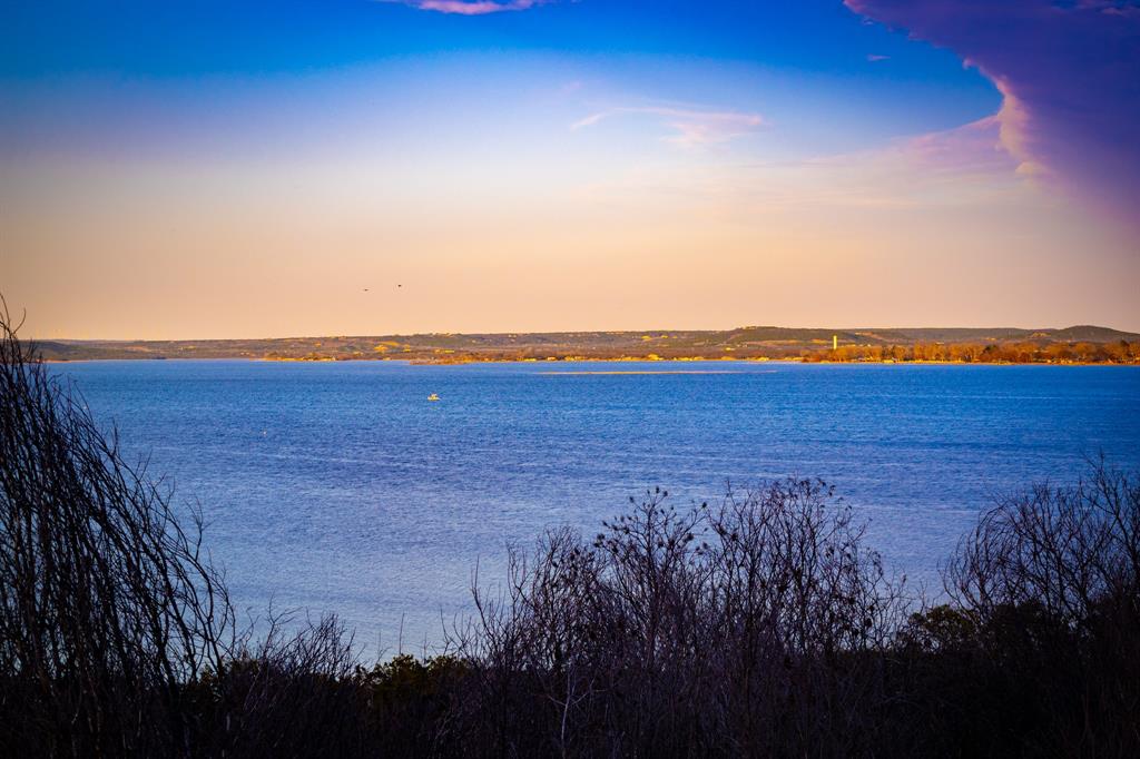 Tbd Tbd Clearwater Point Graham, TX 76450 - Photo 9 of 10 a view of ocean with sunset