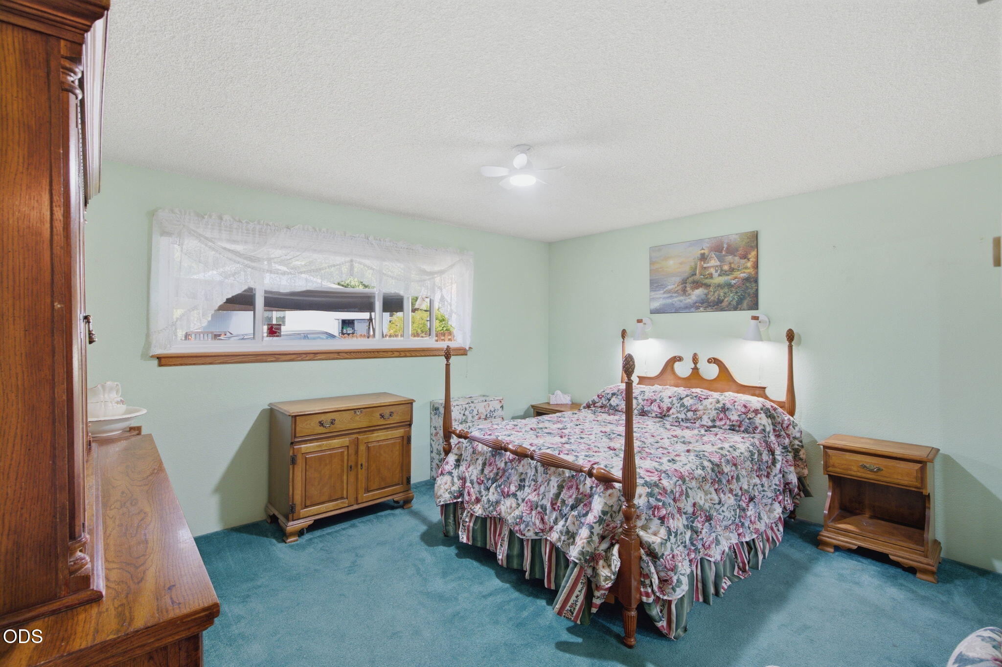 103 Brookside Court Rogue River, OR 97537 - Photo 12 of 27 a bedroom with a bed and a table in it