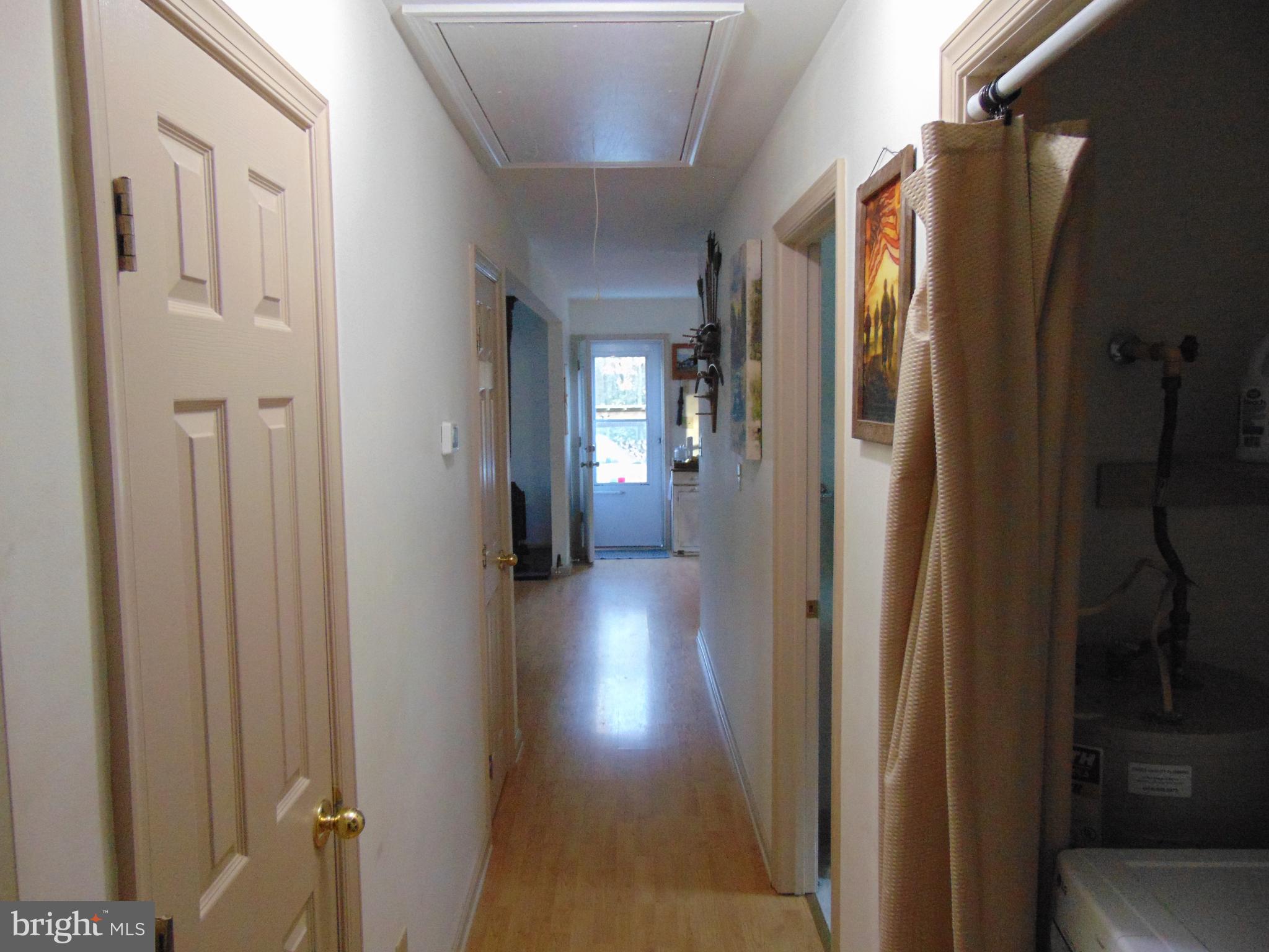 24795 Pinetown Road Denton, MD 21629 - Photo 35 of 60 Looking down hallway at kitchen door