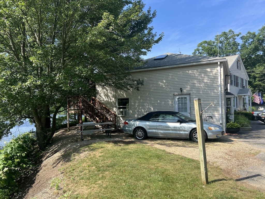 68-74 Sturbridge Road Charlton, MA 01507 - Photo 21 of 41 a car parked in front of a house