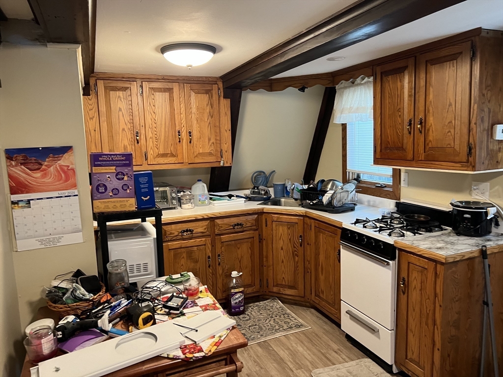 68-74 Sturbridge Road Charlton, MA 01507 - Photo 22 of 41 a kitchen with a sink stove and refrigerator