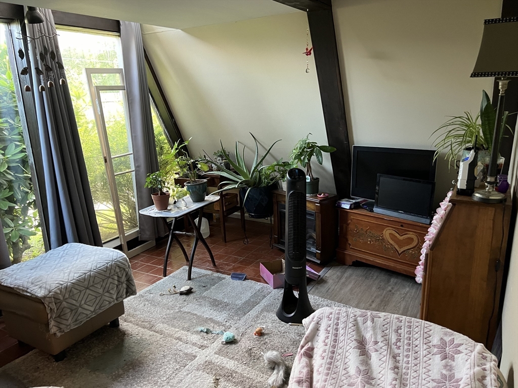 68-74 Sturbridge Road Charlton, MA 01507 - Photo 24 of 41 a living room with furniture and a flat screen tv