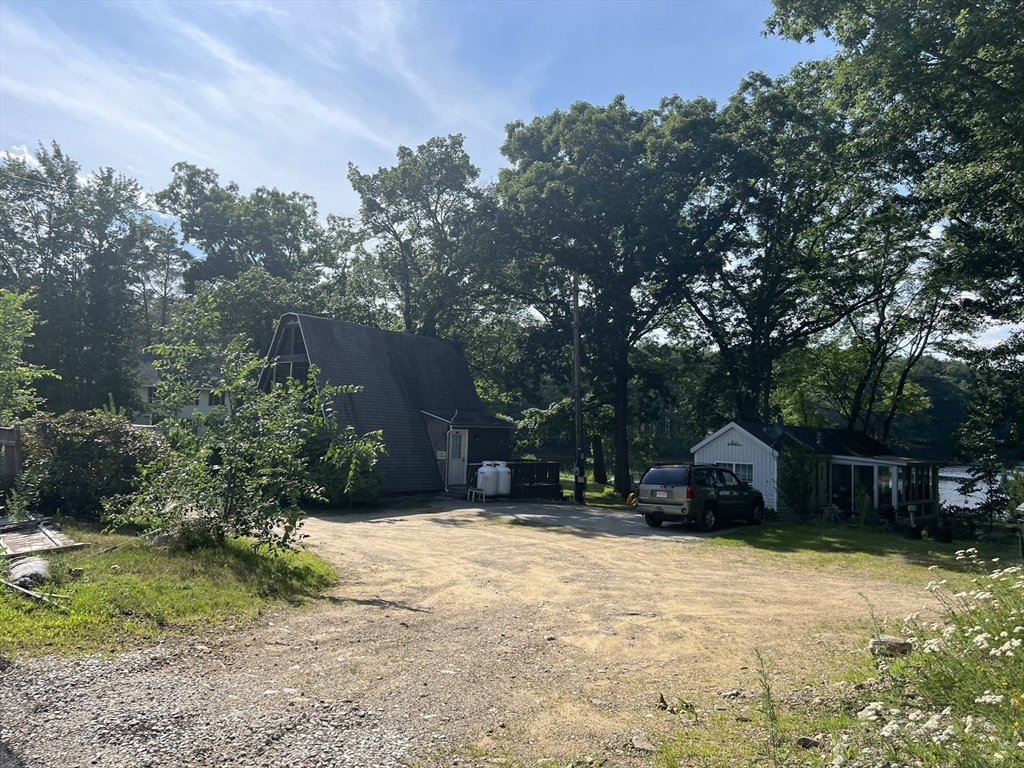 68-74 Sturbridge Road Charlton, MA 01507 - Photo 35 of 41 a backyard of a house with yard and trampoline