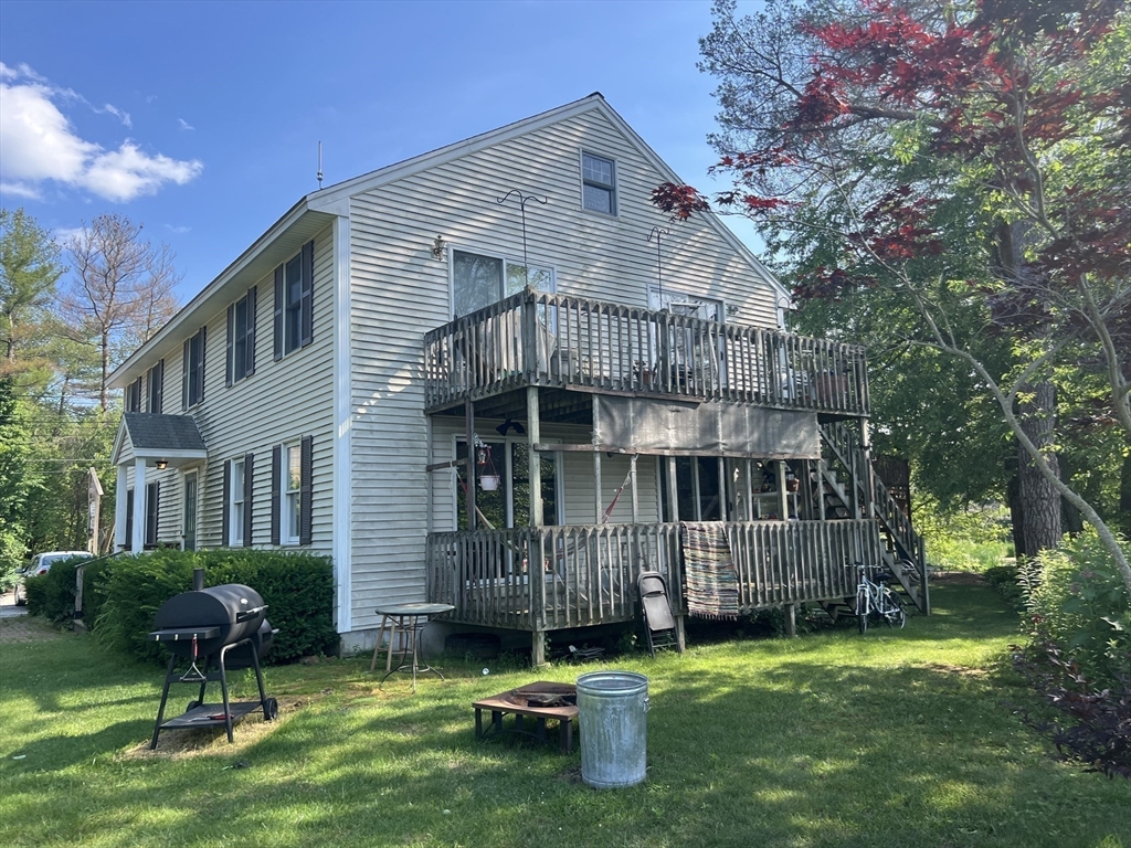 68-74 Sturbridge Road Charlton, MA 01507 - Photo 8 of 41 a backyard of a house with table and chairs