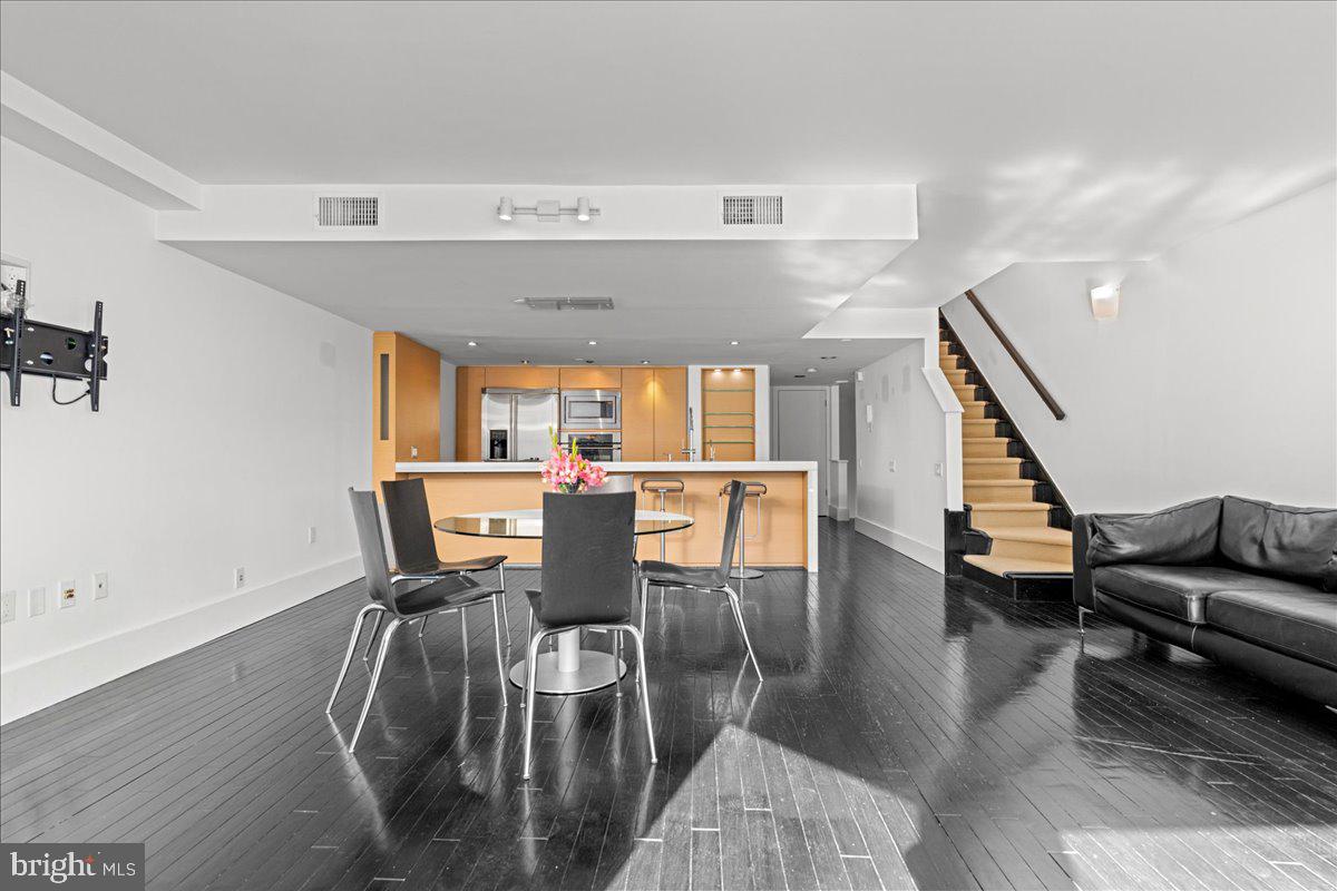 350 River Road, Unit D10 New Hope, PA 18938 - Photo 14 of 41 a view of a dining room with furniture and wooden floor