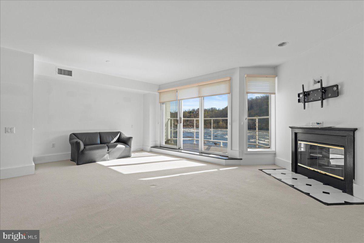 350 River Road, Unit D10 New Hope, PA 18938 - Photo 18 of 41 a living room with furniture and a fireplace