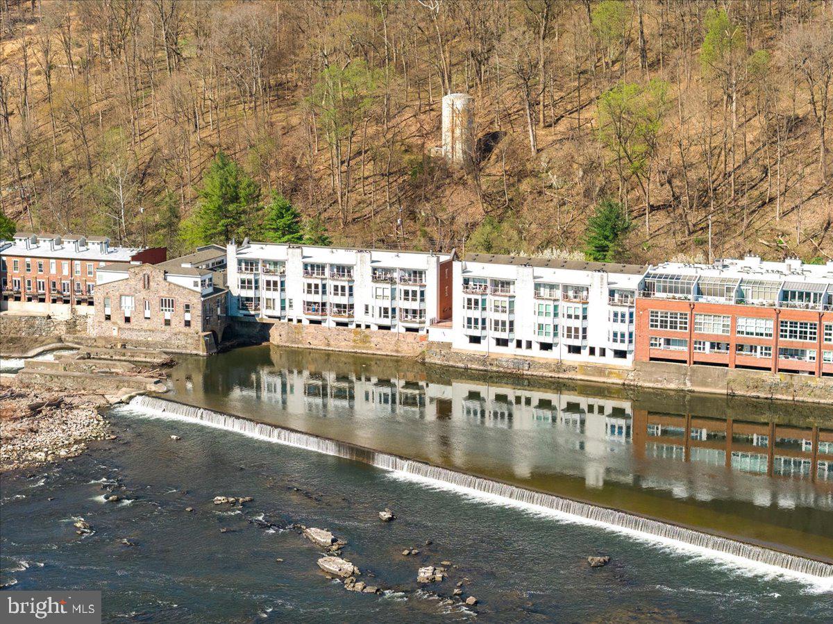 350 River Road, Unit D10 New Hope, PA 18938 - Photo 41 of 41 a view of a swimming pool with outdoor seating