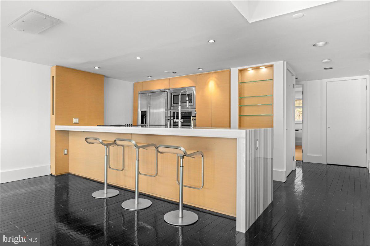 350 River Road, Unit D10 New Hope, PA 18938 - Photo 6 of 41 a kitchen with stainless steel appliances granite countertop a sink and cabinets
