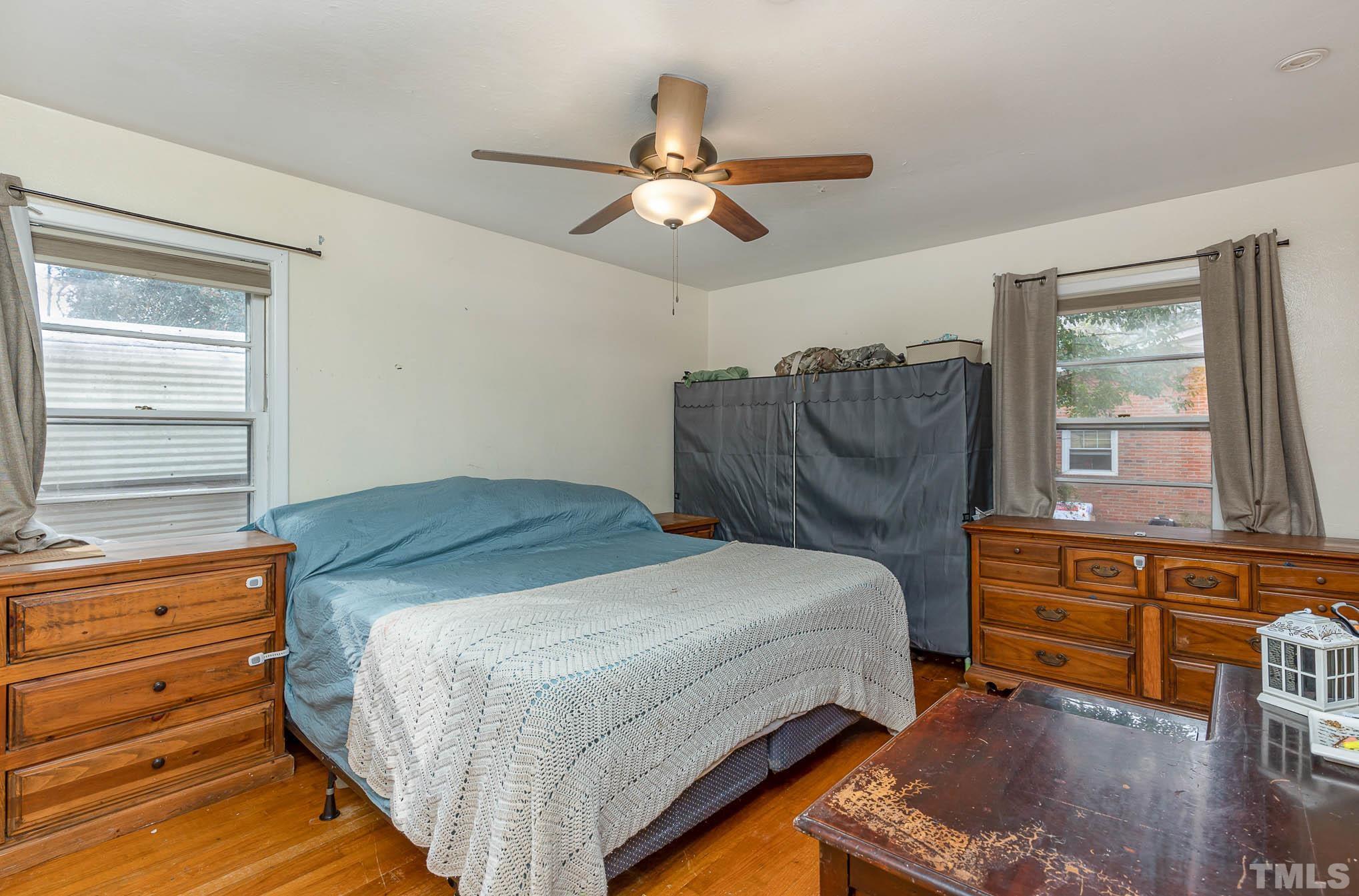 3625 Drayton Road Fayetteville, NC 28303 - Photo 11 of 23 a bedroom with a bed and wooden floor
