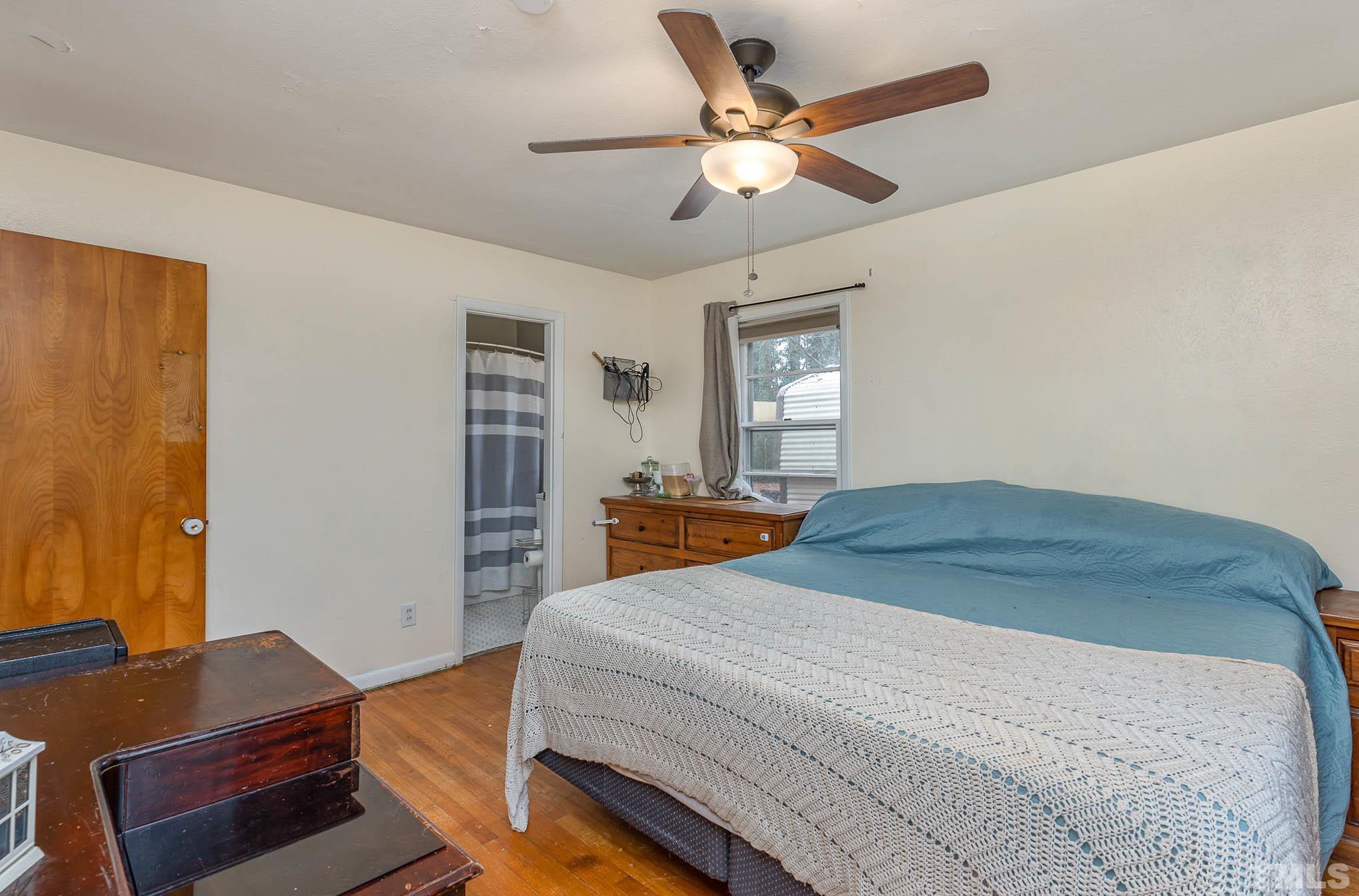3625 Drayton Road Fayetteville, NC 28303 - Photo 12 of 23 a bedroom with a bed and a window