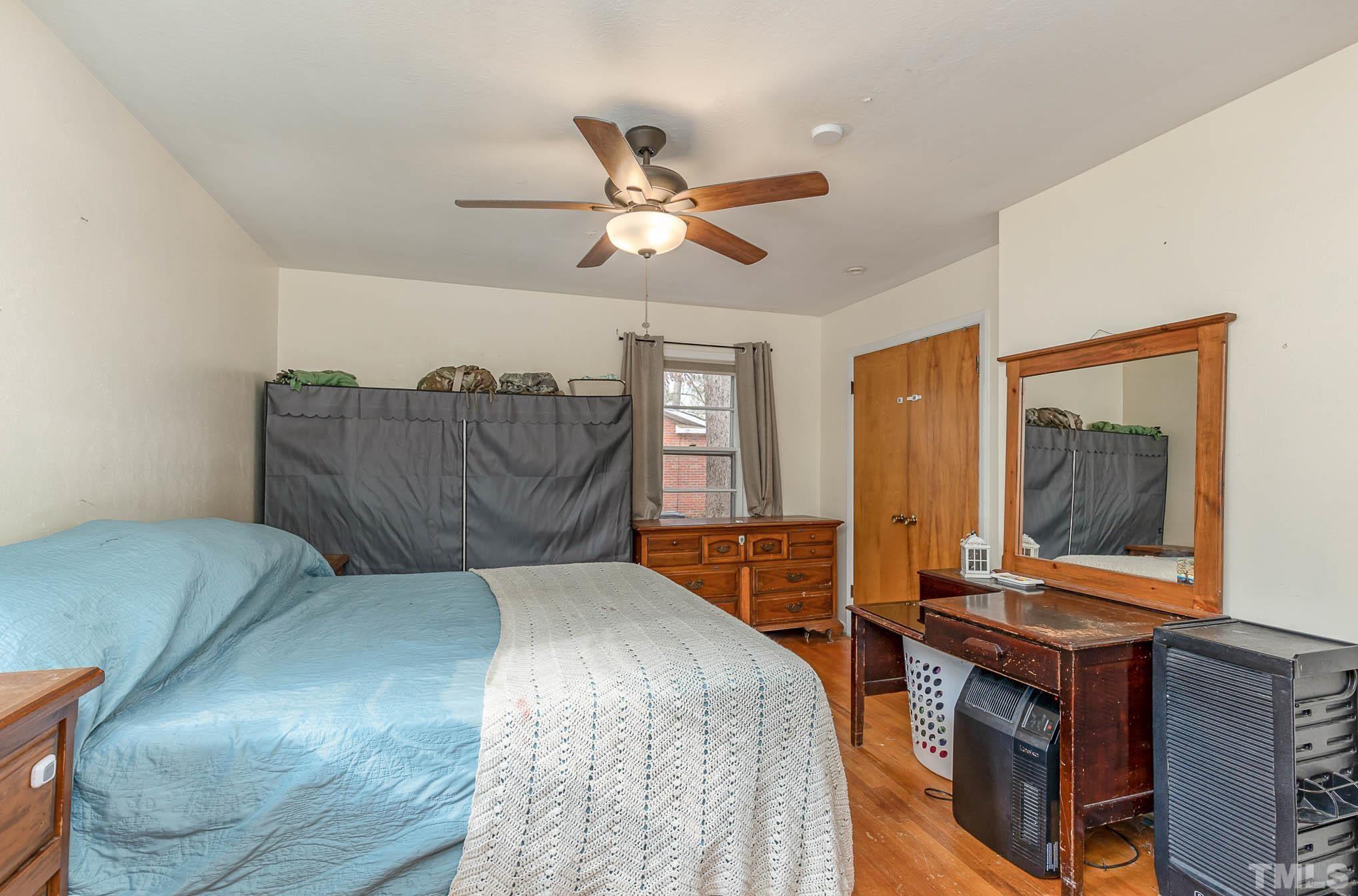 3625 Drayton Road Fayetteville, NC 28303 - Photo 13 of 23 a bed room with a bed and a television