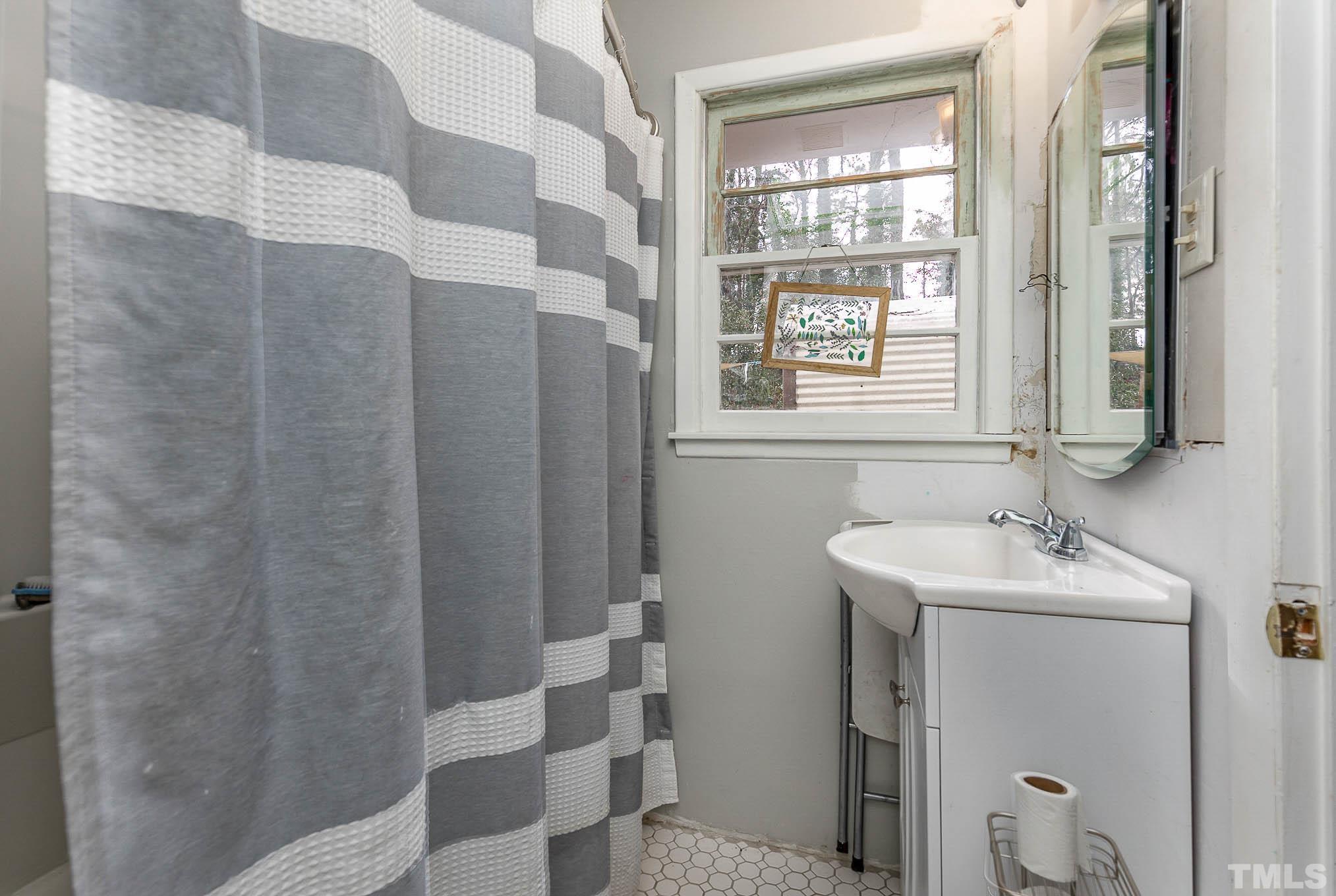3625 Drayton Road Fayetteville, NC 28303 - Photo 14 of 23 a bathroom with a sink toilet and shower
