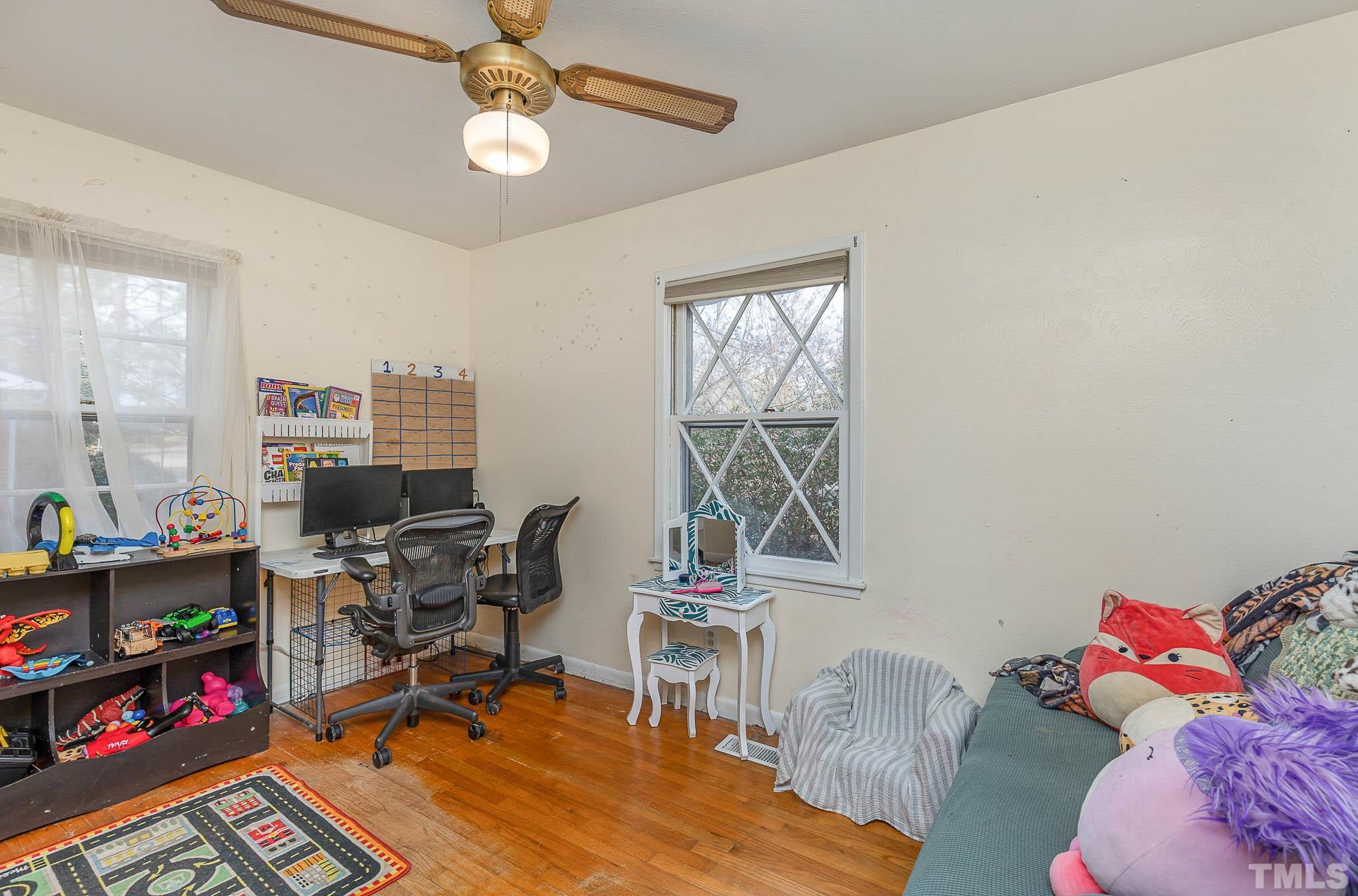 3625 Drayton Road Fayetteville, NC 28303 - Photo 16 of 23 a workspace with furniture hardwood and a window