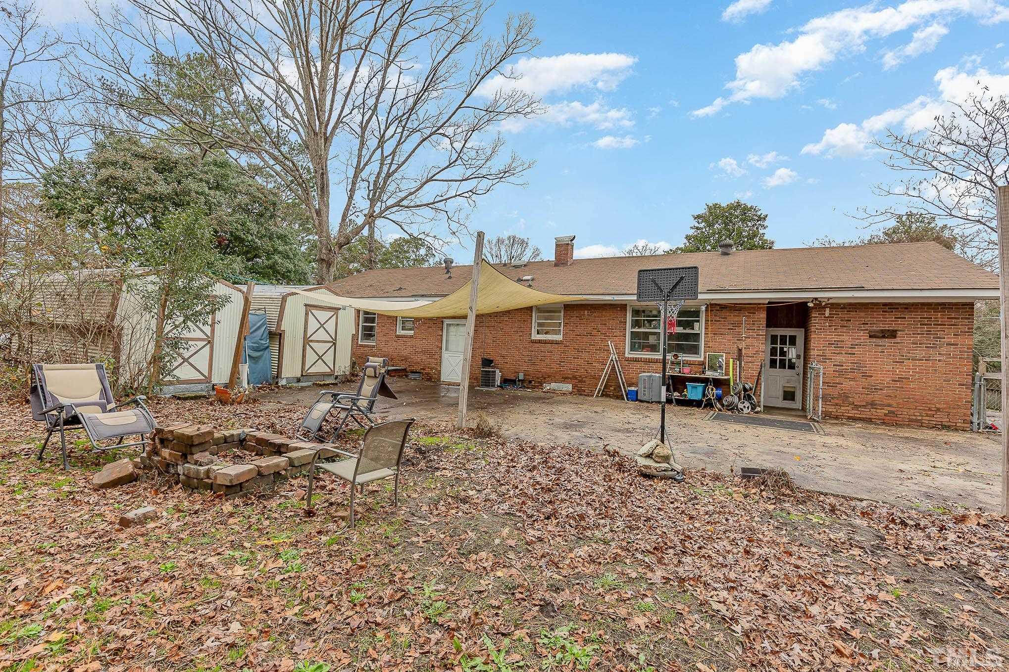 3625 Drayton Road Fayetteville, NC 28303 - Photo 22 of 23 a view of a blue house with a yard and outdoor space