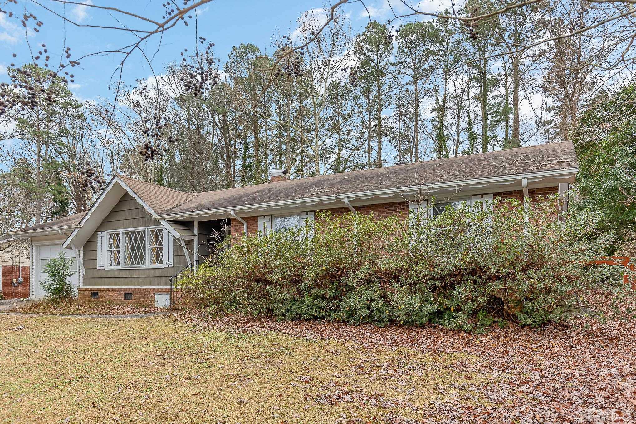 3625 Drayton Road Fayetteville, NC 28303 - Photo 3 of 23 a front view of a house with garden