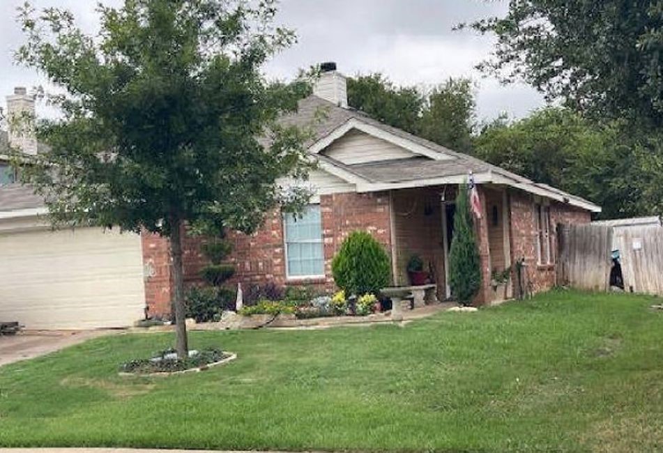 1144 Switchgrass Lane Crowley, TX 76036 - Photo 2 of 4 a front view of house with yard and green space