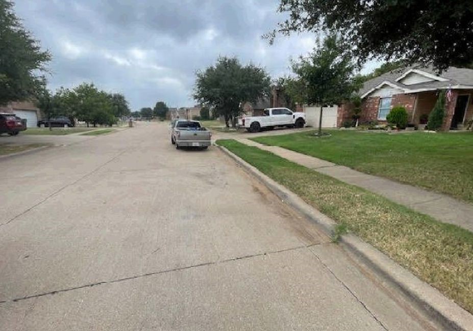 1144 Switchgrass Lane Crowley, TX 76036 - Photo 4 of 4 a car parked on the side of the road