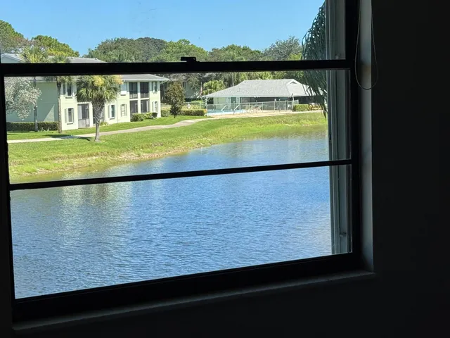 a view of swimming pool with a lake view