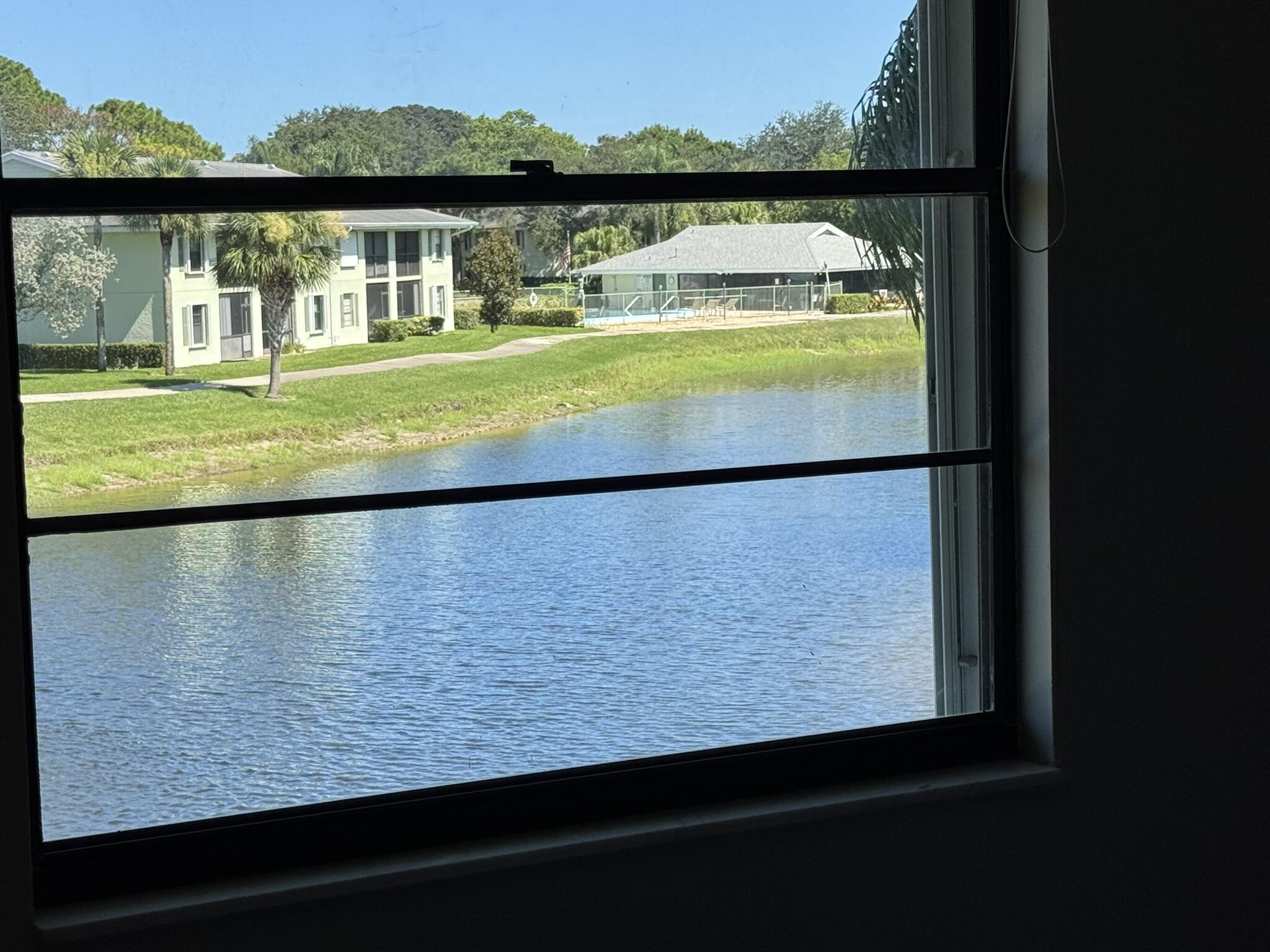 801 Sabal Ridge Circle, Unit H Palm Beach Gardens, FL 33418 - Photo 16 of 42 a view of swimming pool with a lake view