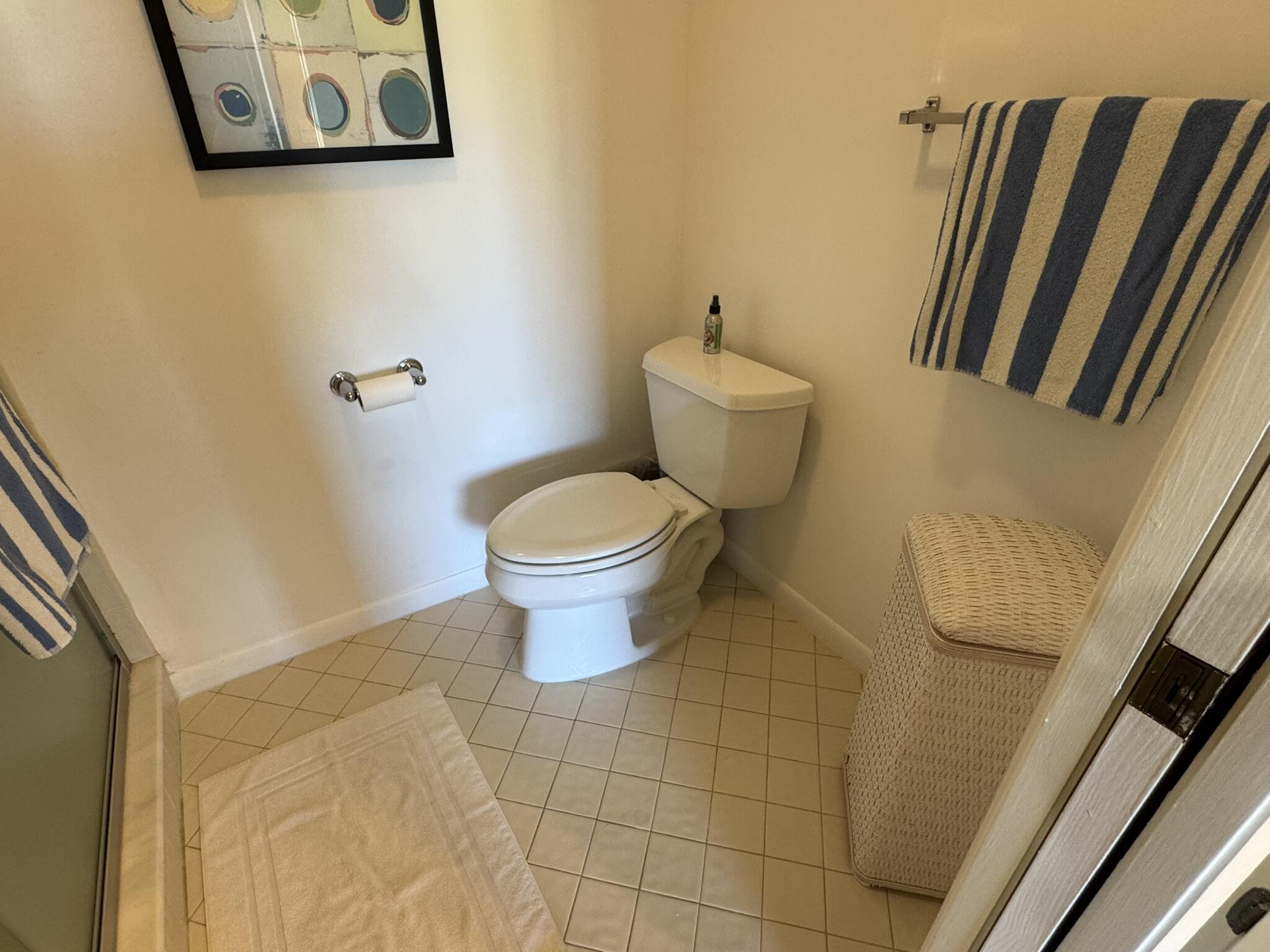 801 Sabal Ridge Circle, Unit H Palm Beach Gardens, FL 33418 - Photo 27 of 42 a bathroom with a toilet and a shower