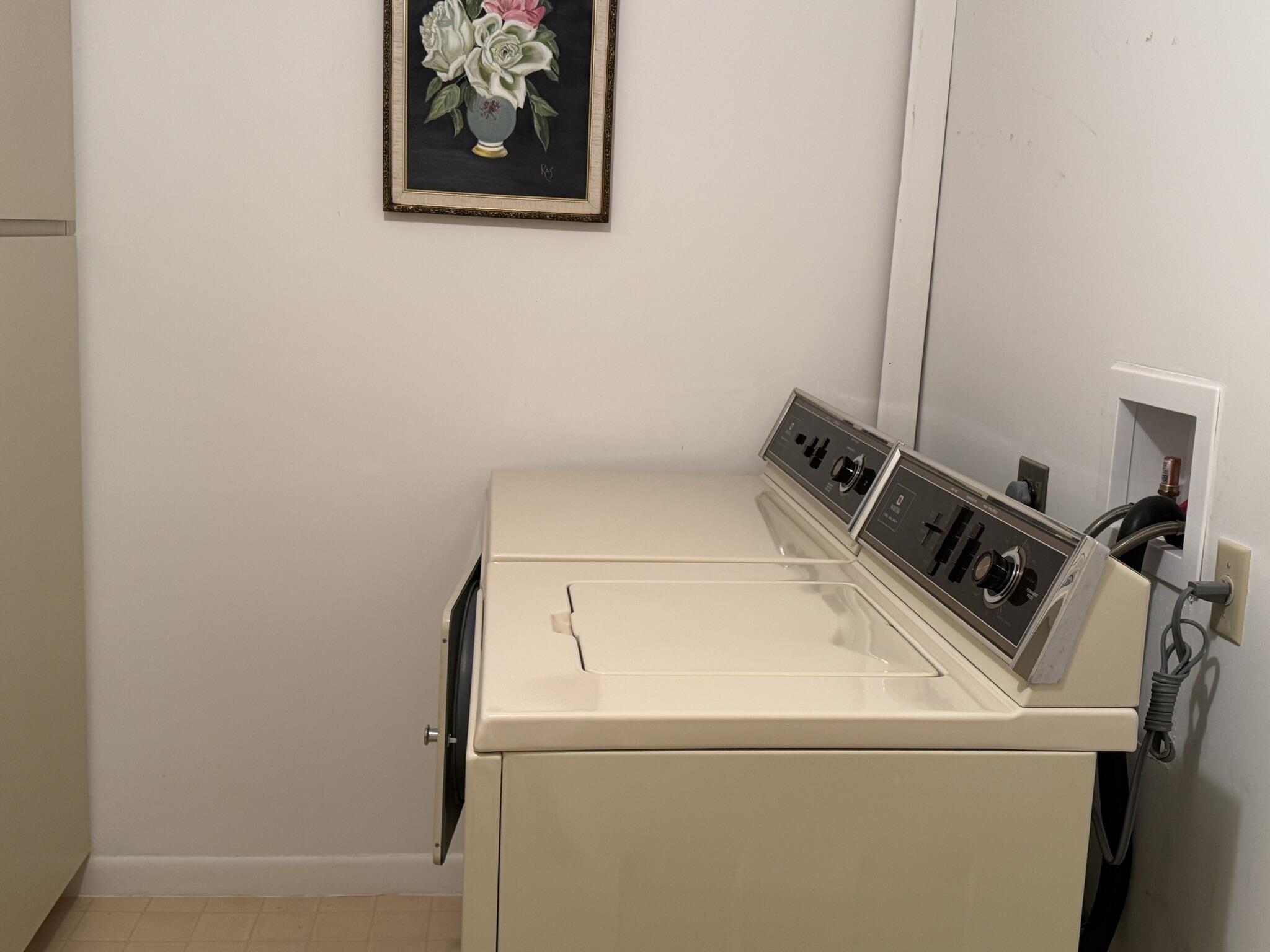 801 Sabal Ridge Circle, Unit H Palm Beach Gardens, FL 33418 - Photo 35 of 42 a utility room with dryer and washer