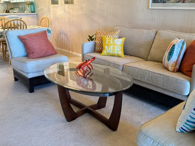 a living room with furniture and a rug