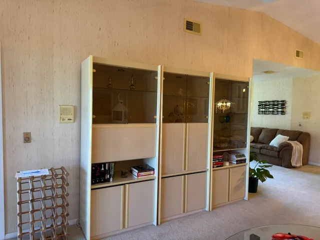 a kitchen with furniture a refrigerator and a sink