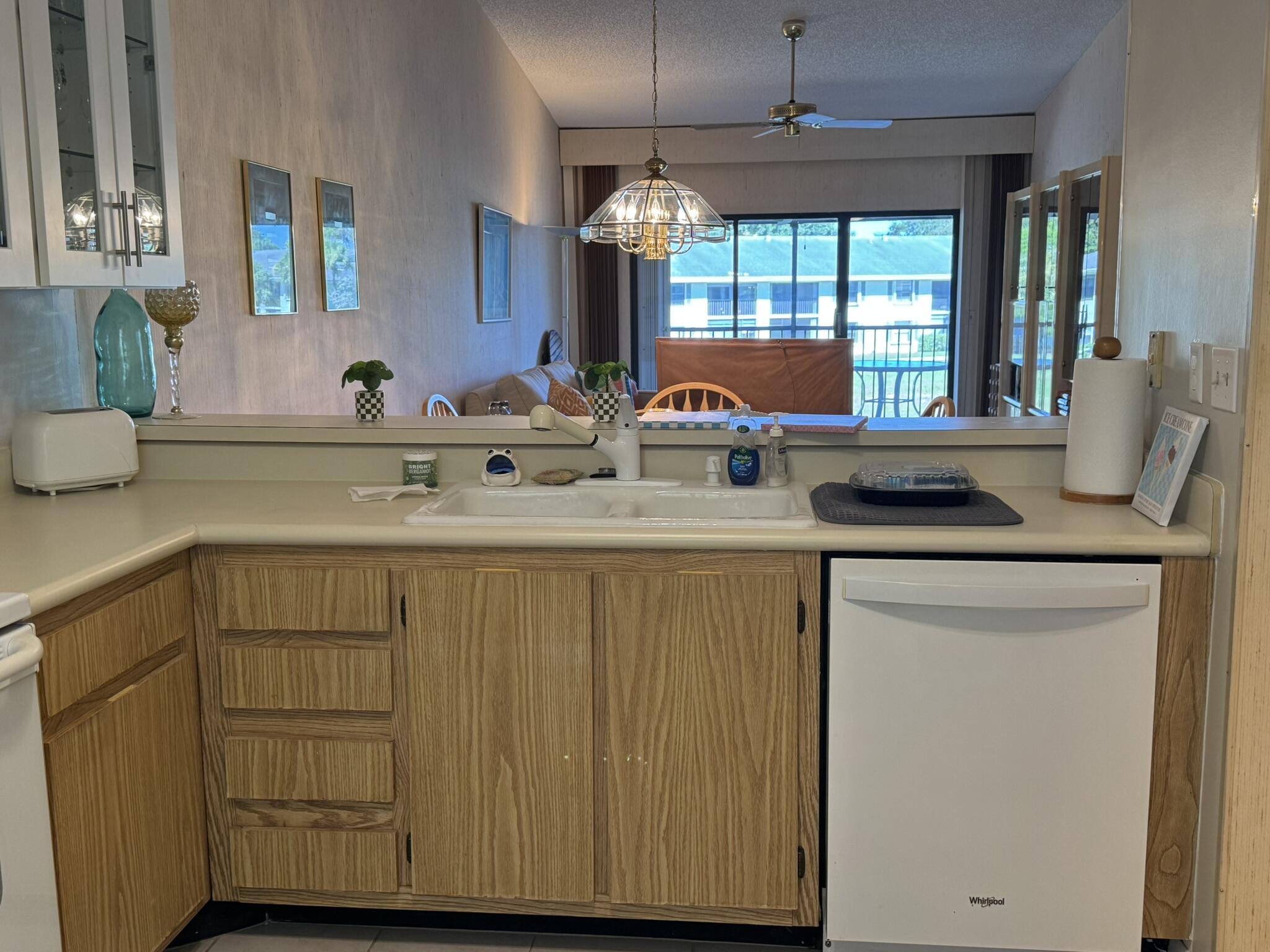801 Sabal Ridge Circle, Unit H Palm Beach Gardens, FL 33418 - Photo 10 of 42 a kitchen with a sink cabinets and window