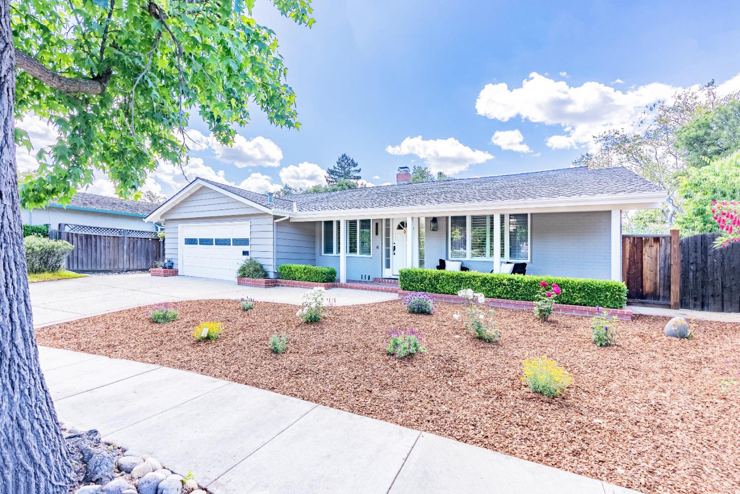 a front view of house with an outdoor space