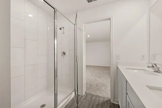 a view of a big room with a big yard and large tree