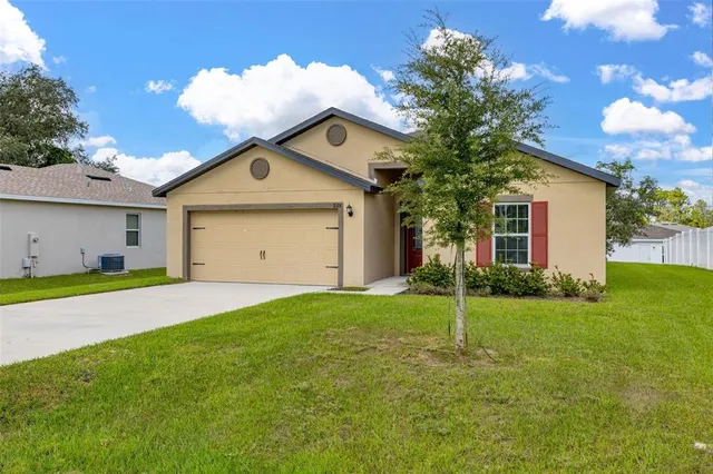 a view of a kitchen with wooden floor and a kitchen