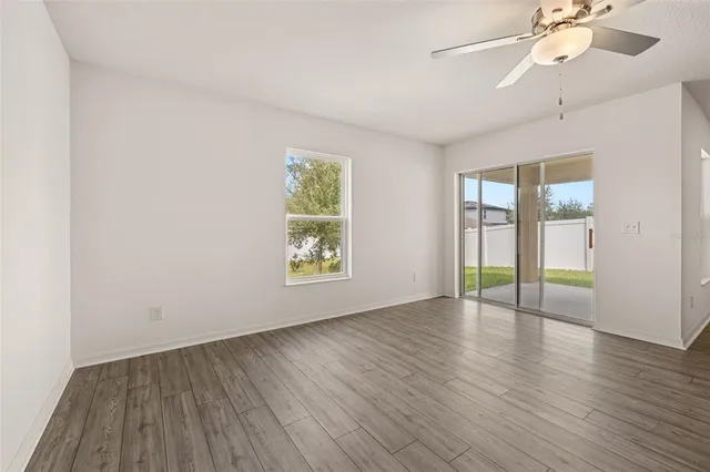 a view of a kitchen with a sink and a refrigerator