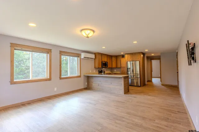 a view of a kitchen with a sink and a window