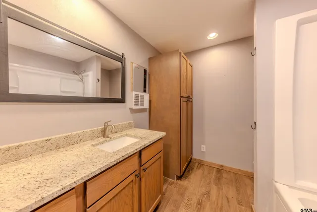 a bathroom with a sink and a mirror
